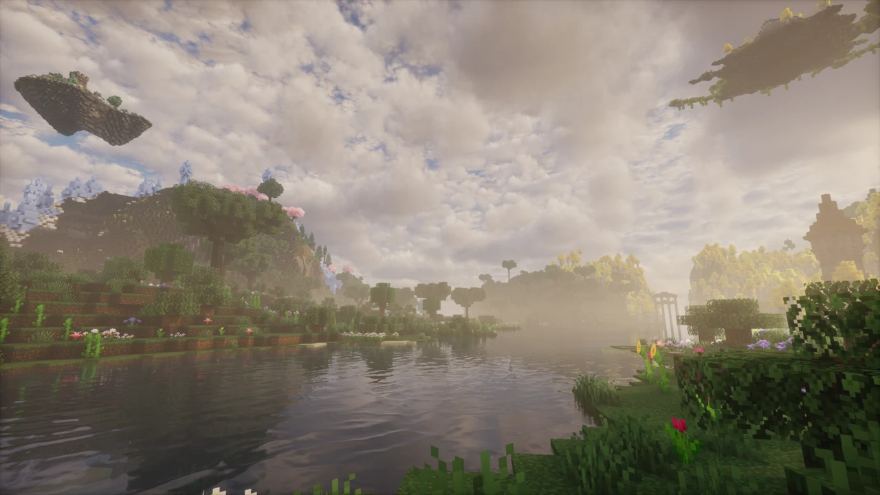 A calm lake with flowering shores and islands floating in the sky, under soft misty light