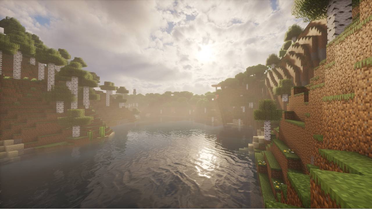 The same Minecraft river valley with a shaderpack enabled, showing layered clouds, sun glare through the trees and reflections across the water